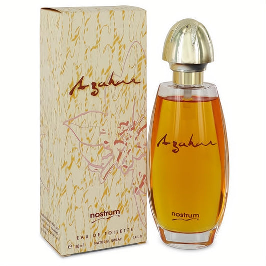 Azahar by Nostrum 3.4 oz Eau De Toilette. Clear bottle with radiant amber liquid, elegant gold cap, and decorative floral box.