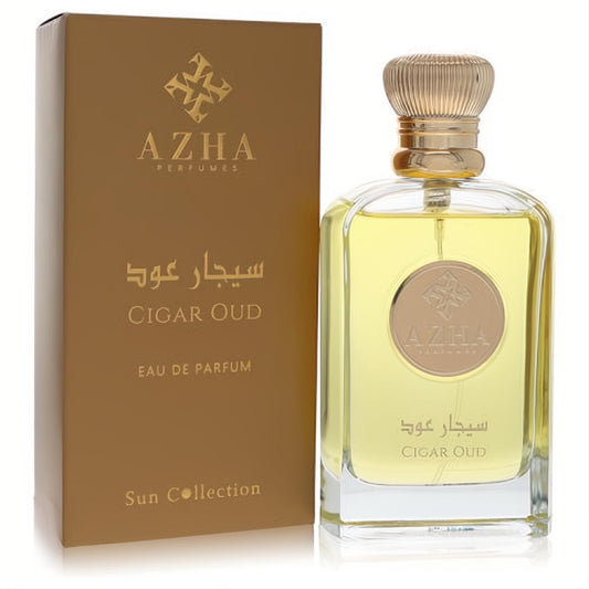Luxurious Azha Cigar Oud 3.3 oz EDP spray, clear glass bottle with golden liquid, fluted gold cap, and elegant matte gold box.