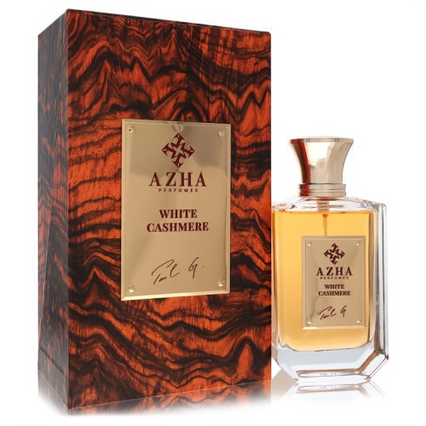 Luxurious Azha White Cashmere 3.3 oz unisex EDP. Amber liquid in faceted glass bottle with gold accents, beside its rich wood-grain box.