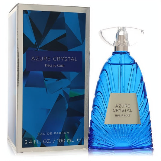 Thalia Sodi Azure Crystal 3.4 oz EDP. Captivating blue faceted glass bottle with unique clear cap, beside its matching geometric box.