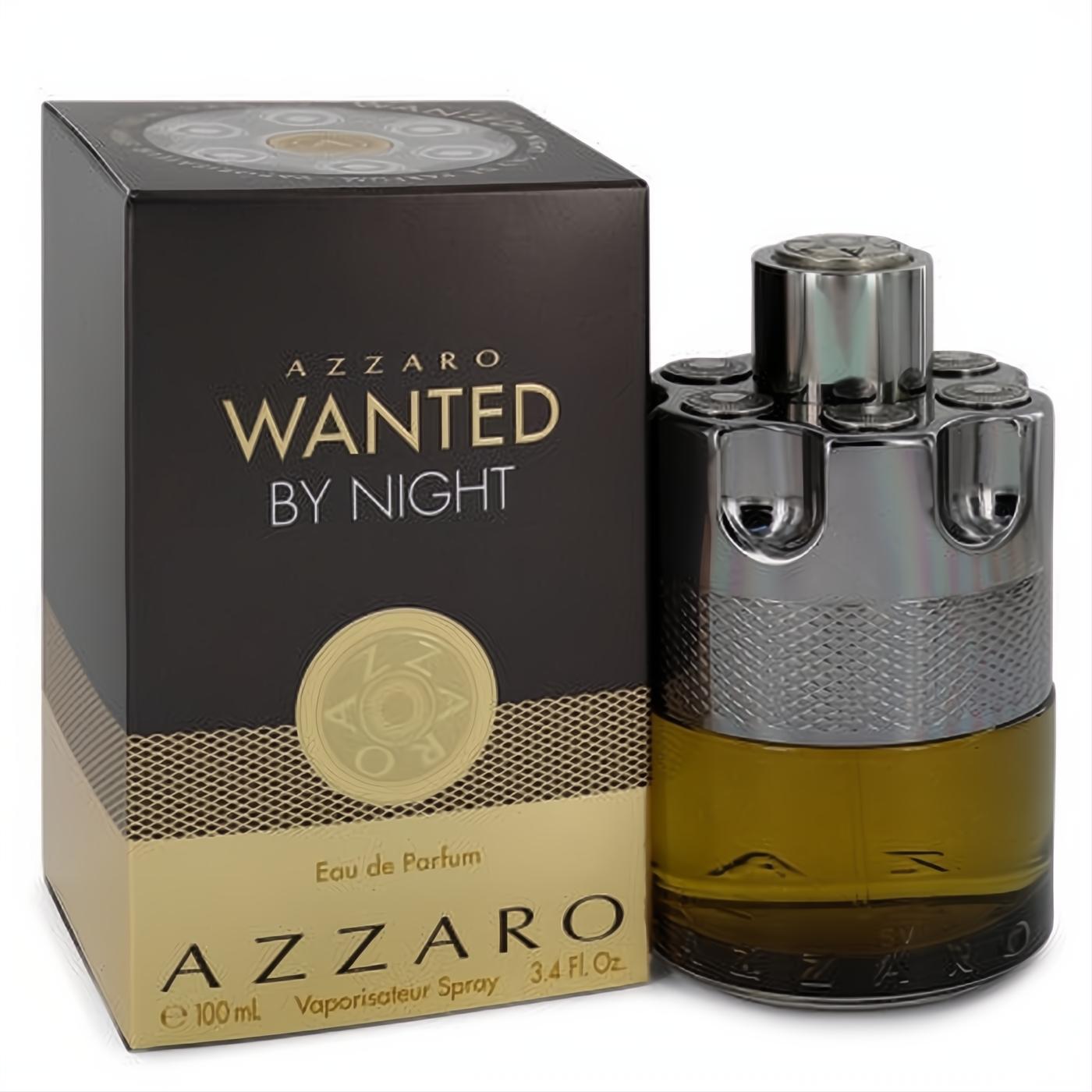 Azzaro Wanted By Night 3.4 oz men's EDP spray. Bold metallic silver bullet bottle with amber liquid, next to its elegant dark gold box.