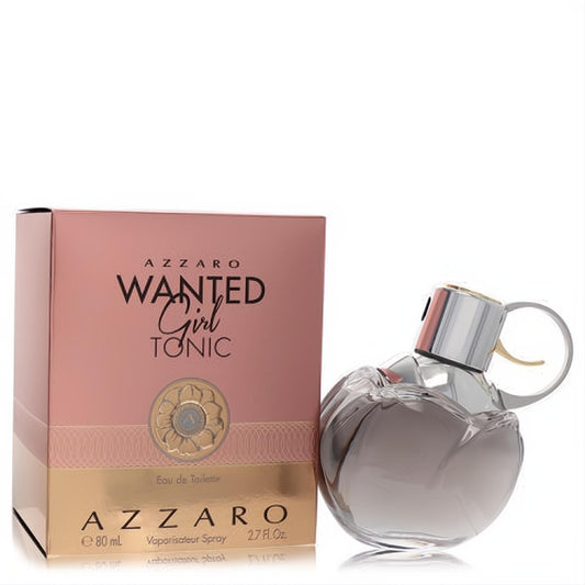 Azzaro Wanted Girl Tonic 2.7 oz EDT. Striking grenade-shaped clear glass bottle with silver and gold details, beside its chic pink and gold box.