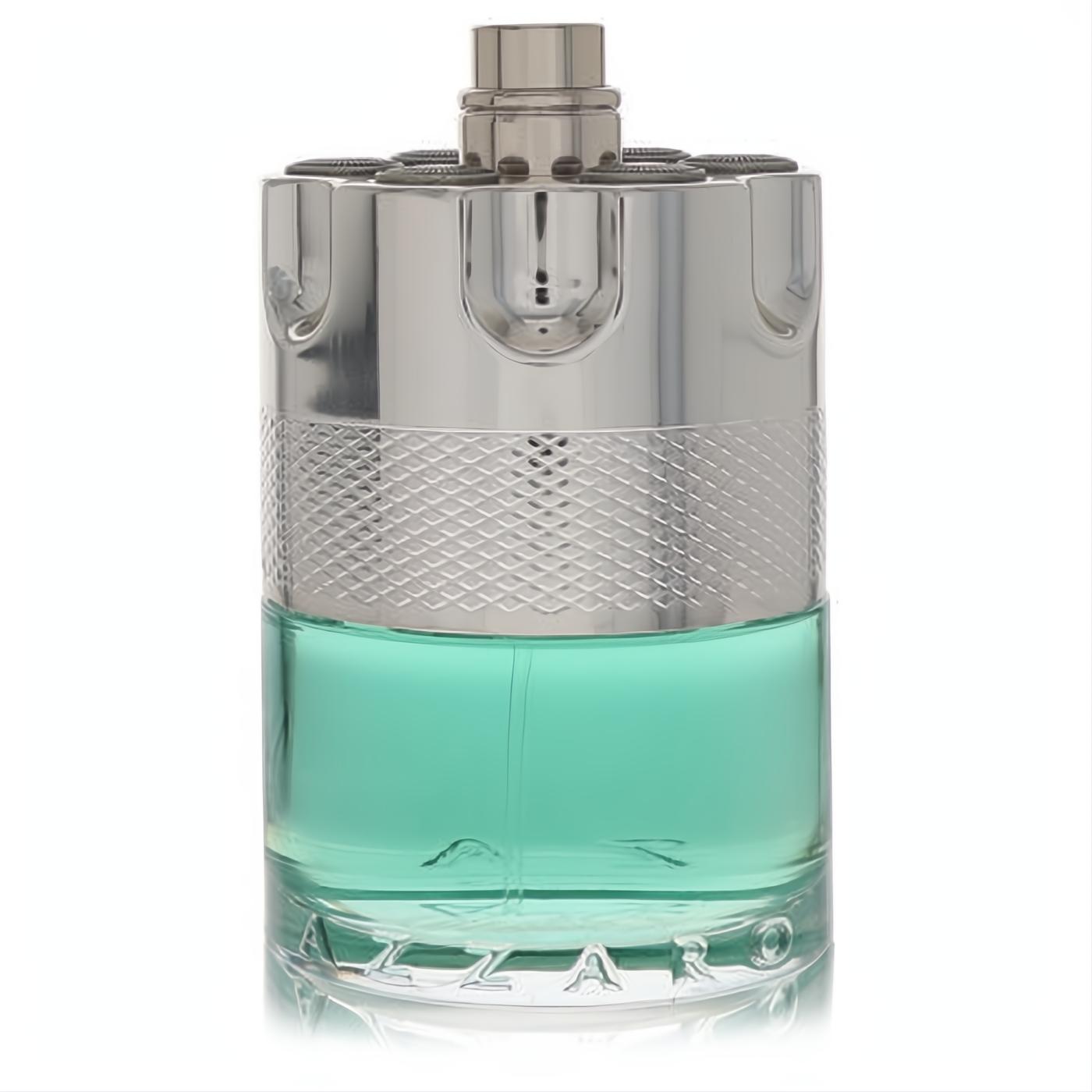 Azzaro Wanted Tonic men's cologne bottle featuring vibrant aqua liquid and a striking silver metallic revolver-style cap.