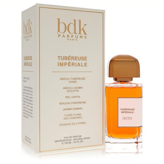 Luxurious BDK Tubereuse Imperiale 3.4 oz unisex EDP. Amber liquid in a sleek glass bottle with gold cap, next to its elegant white box.