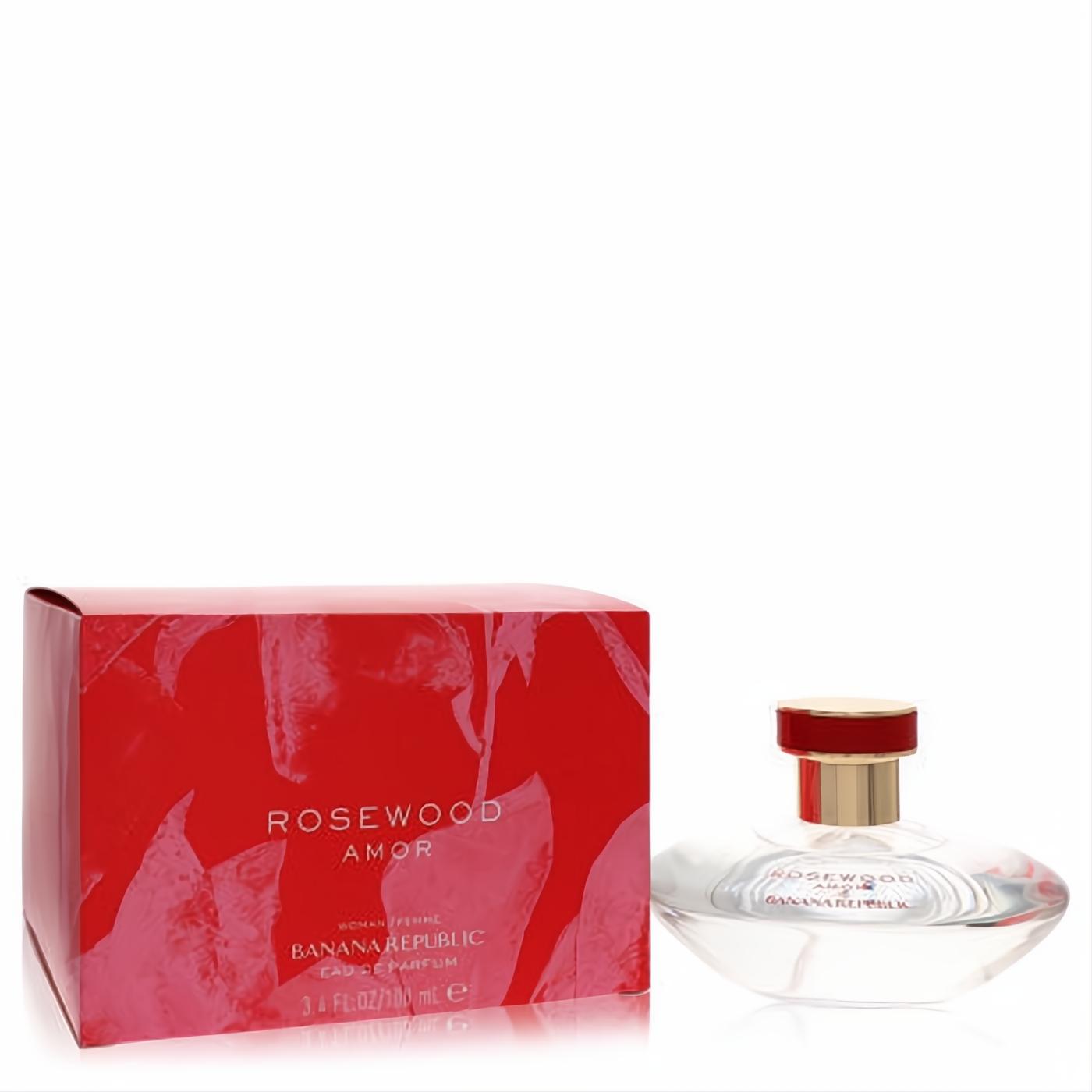 Captivating Banana Republic Rosewood Amor 3.4 oz Eau de Parfum. Clear glass bottle with gold and red cap, next to its vibrant red box.