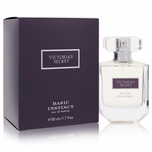 Victoria's Secret Basic Instinct 1.7 oz Eau De Parfum. Elegant clear glass bottle with faceted cap and matching dark plum box.