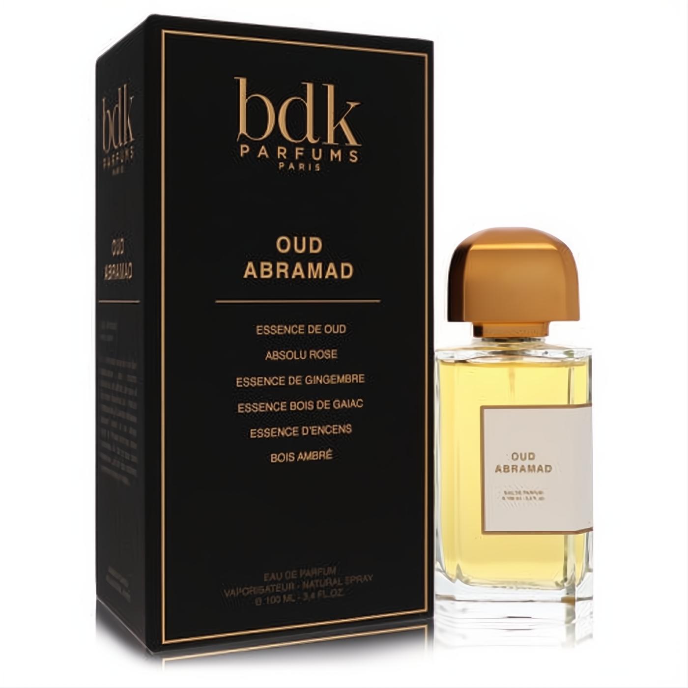 Elegant Bdk Oud Abramad 3.4 oz unisex Eau de Parfum bottle with luxurious gold cap, displayed with its sleek black and gold box.