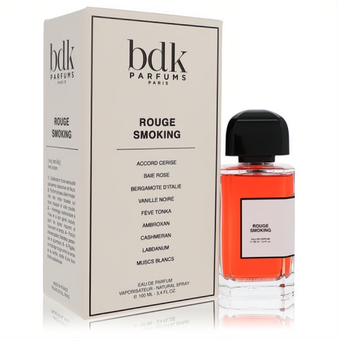 Bdk Rouge Smoking 3.4 oz Eau De Parfum spray. Vibrant red glass bottle with black cap, displayed with its elegant white box.