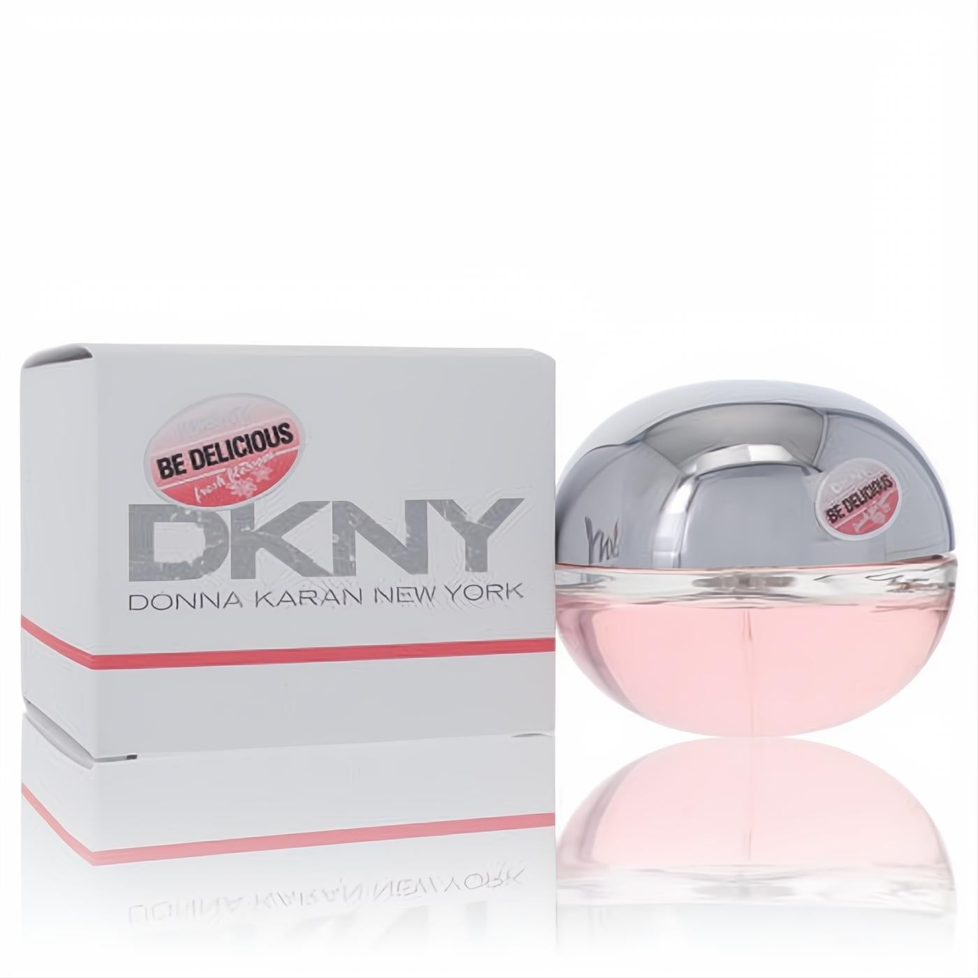 Experience Donna Karan Be Delicious Fresh Blossom 1.7 oz EDP. Iconic pink apple bottle with silver cap, displayed with its elegant white box.