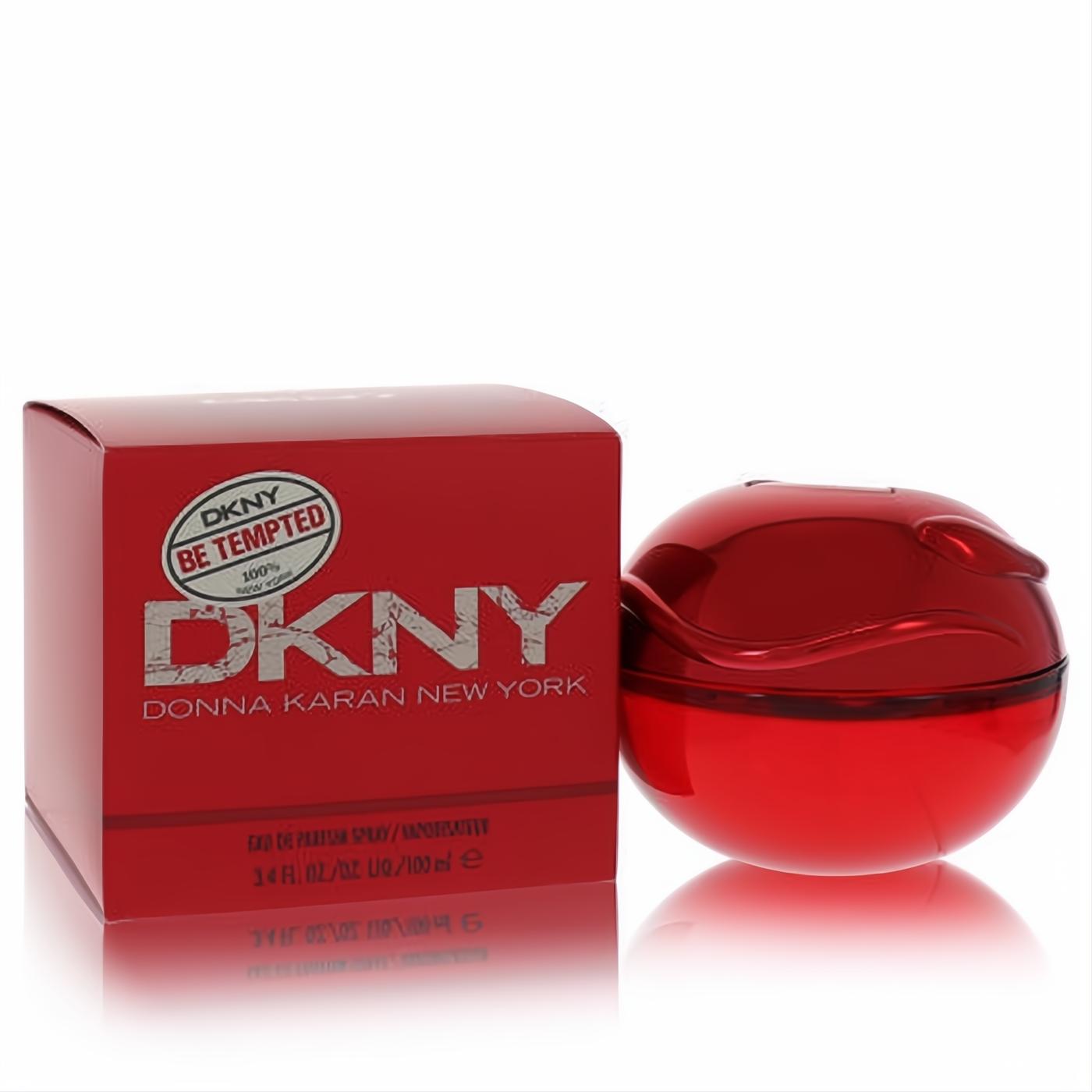 Alluring DKNY Be Tempted 3.4 oz EDP. Vibrant red apple-shaped bottle with a sleek metallic cap, beside its matching designer box.