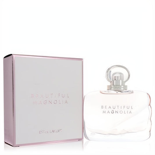 Luxurious Estee Lauder Beautiful Magnolia EDP. Elegant blush pink glass bottle with clear cap, beside its matching metallic-edged box.