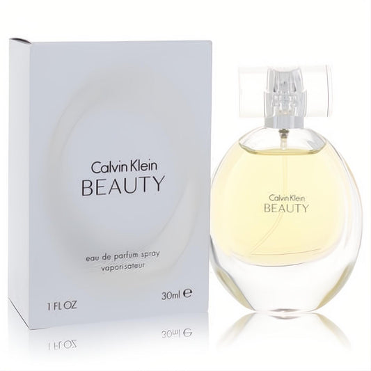 Calvin Klein Beauty 1 oz Eau De Parfum spray. Clear glass bottle with radiant yellow-gold fragrance and elegant white box.