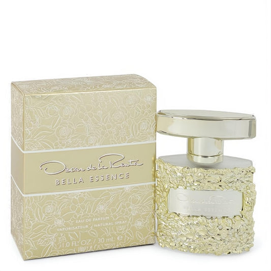 Elegant Oscar De La Renta Bella Essence 1 oz EDP in a stunning gold floral embossed bottle, next to its matching luxurious box.