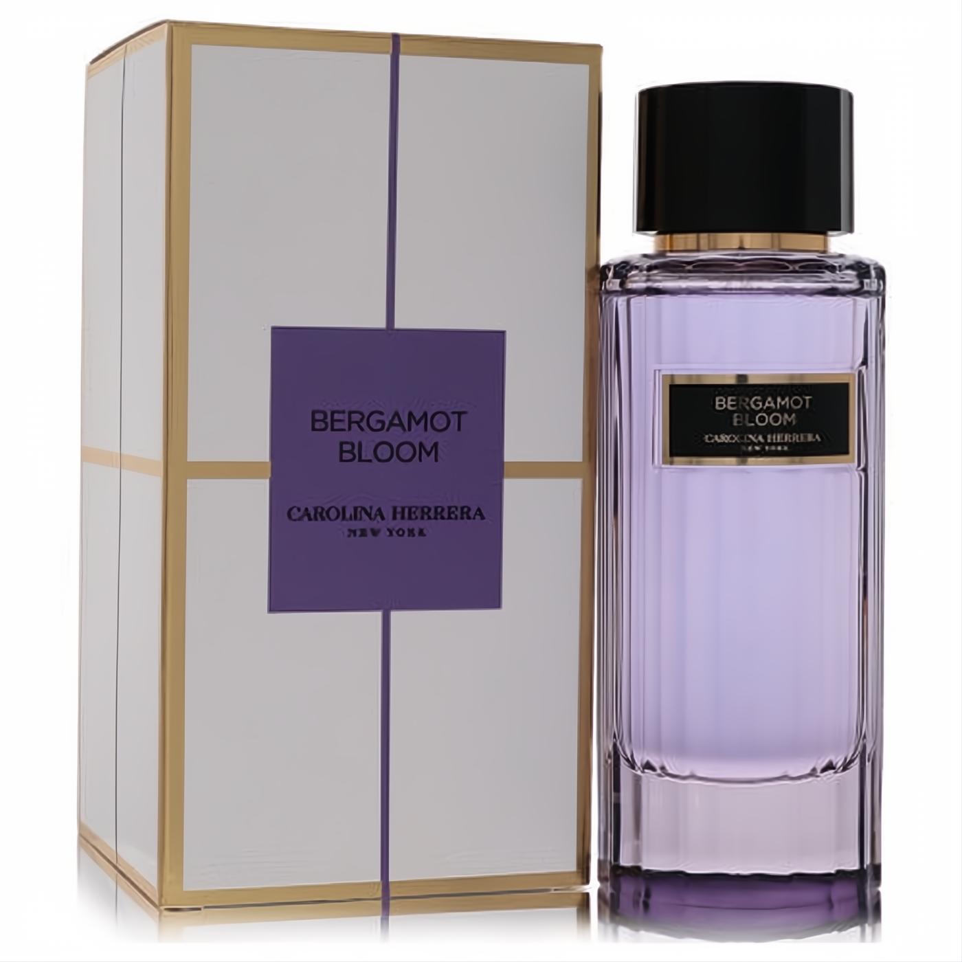 Elegant Carolina Herrera Bergamot Bloom 3.4oz EDT. Lavender liquid in a ribbed glass bottle with gold accents, next to its white and gold box.