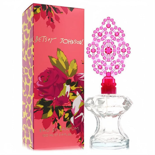 Betsey Johnson 3.4 oz Eau De Parfum spray. Clear faceted bottle, vibrant pink jewel cap, and bold floral-leopard print box.