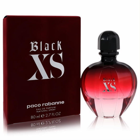 Paco Rabanne Black XS 2.7 oz EDP. Bold dark red gradient bottle with black cap, next to its matching luxurious box.