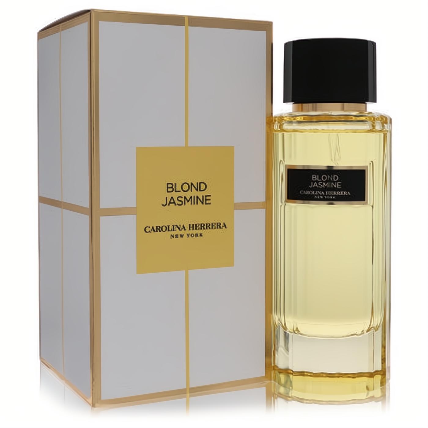 Elegant Carolina Herrera Blond Jasmine 3.4 oz EDT spray. Golden liquid in a ribbed glass bottle with black cap, beside its chic white and gold box.