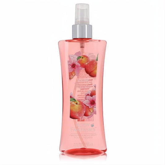 Body Fantasies Sugar Peach 8 oz body spray. Clear pink curved bottle with juicy peach and pink floral illustrations.