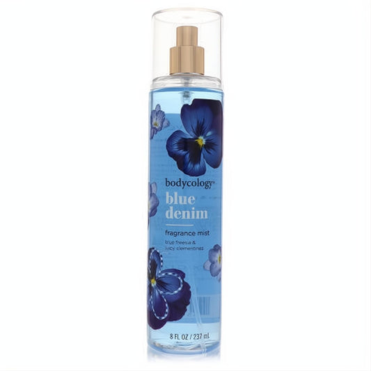 Invigorating Bodycology Blue Denim fragrance mist, 8 oz. Clear bottle, light blue liquid, gold sprayer, and elegant blue pansy floral label.