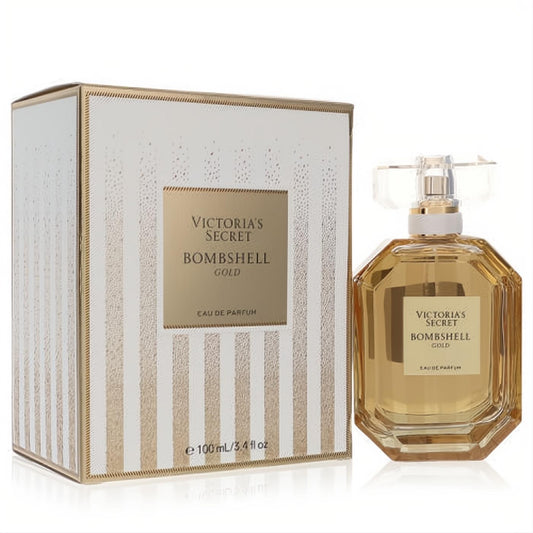 Victoria's Secret Bombshell Gold 3.4 oz EDP. Golden octagonal bottle, clear faceted cap, and a luxurious white-gold striped box.