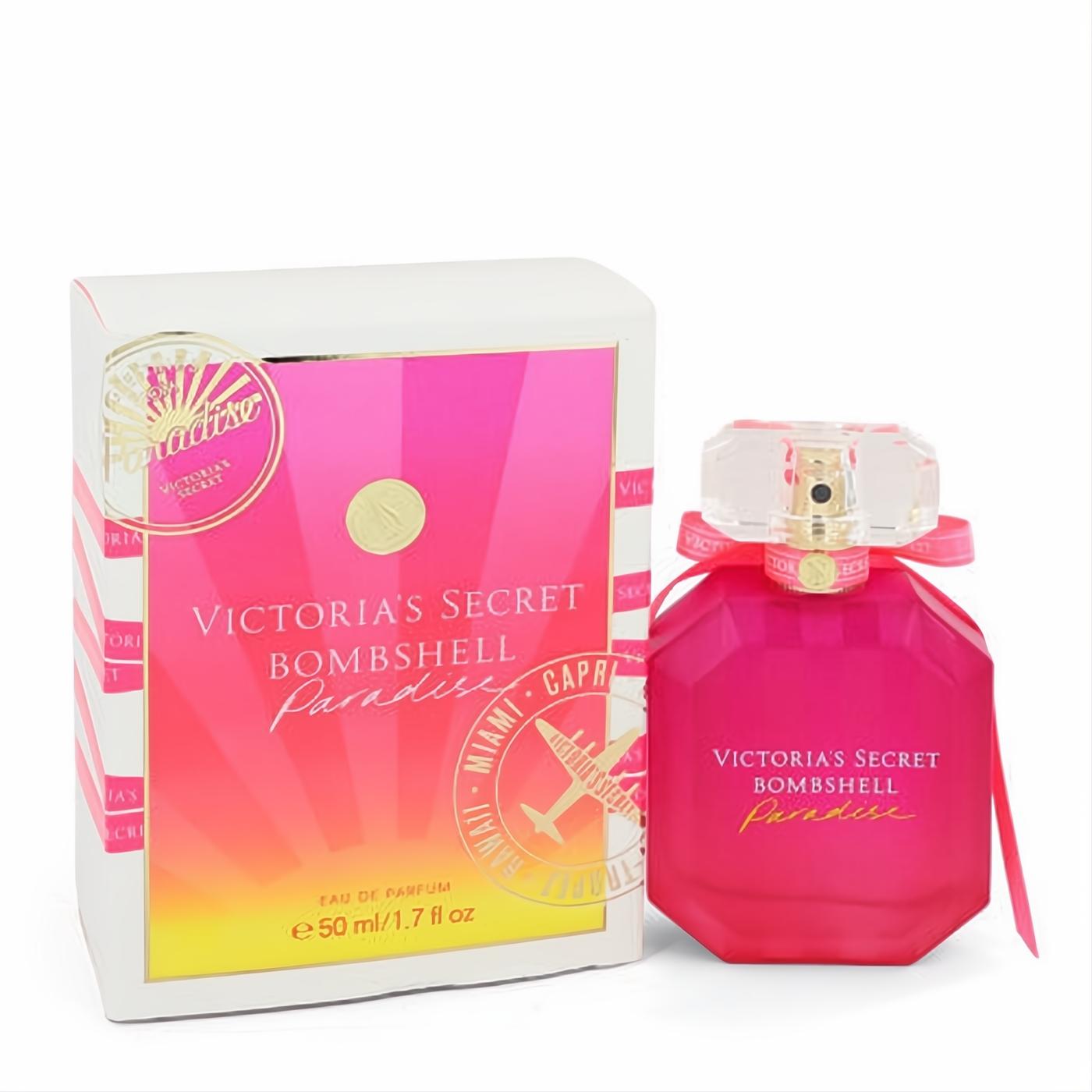 Vibrant fuchsia Victoria's Secret Bombshell Paradise 1.7 oz EDP. Octagonal bottle with gold atomizer, pink ribbon, tropical box.