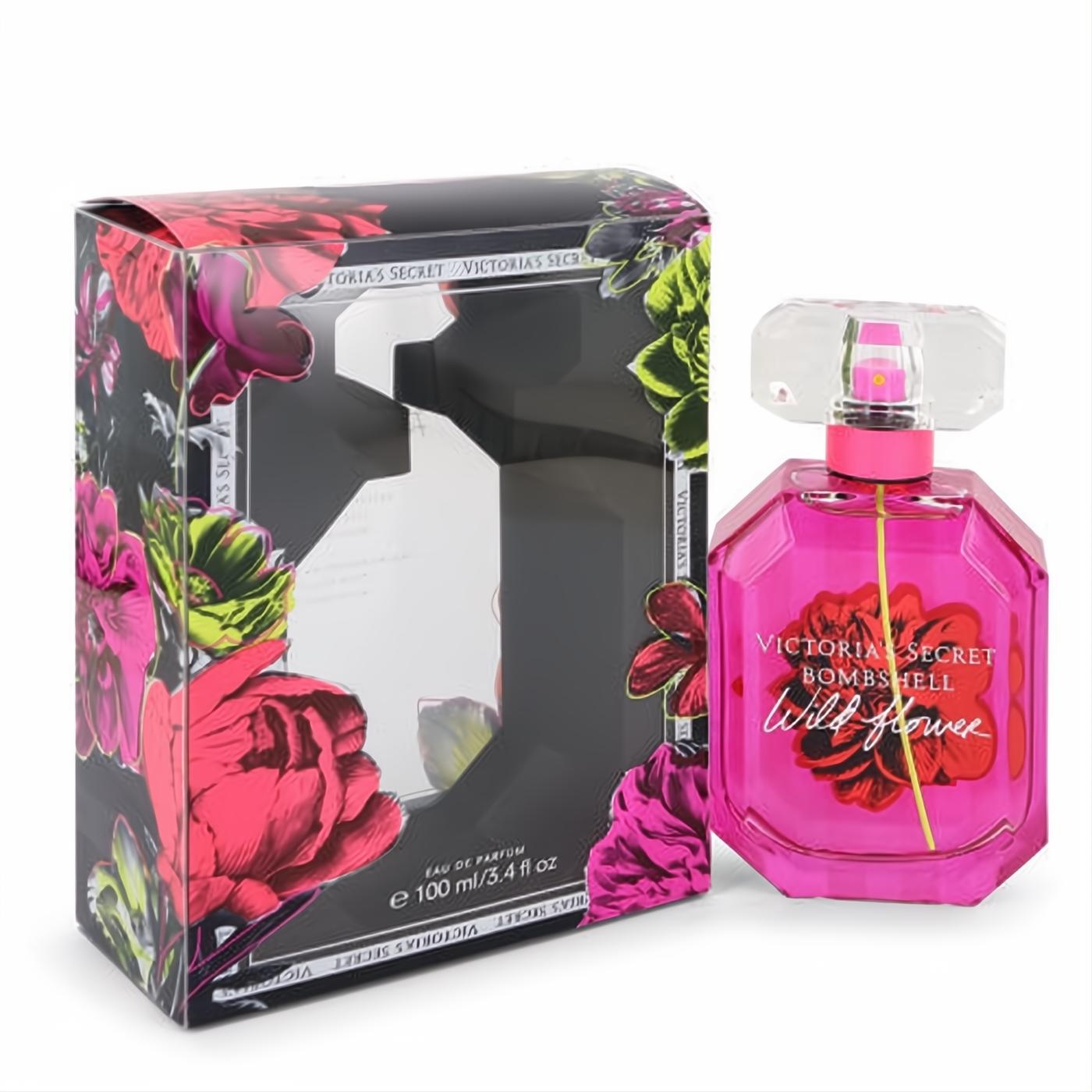 Victoria's Secret Bombshell Wild Flower 3.4 oz EDP. Dazzling pink faceted bottle with a clear cap and elegant floral box.