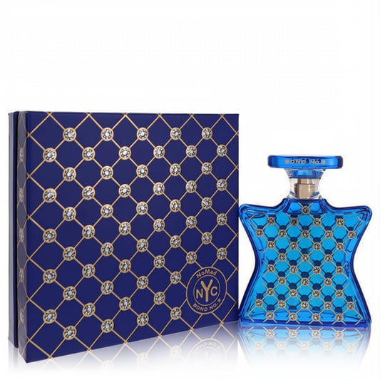 Captivating Bond No. 9 Nomad 3.4 oz EDP. Iconic blue bottle and box with shimmering rhinestone grid design.
