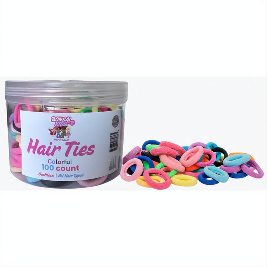 Bonsai Kids 100-count jar of vibrant multi-color elastic hair ties, with a pile of soft, no-crease ponytail holders for girls.