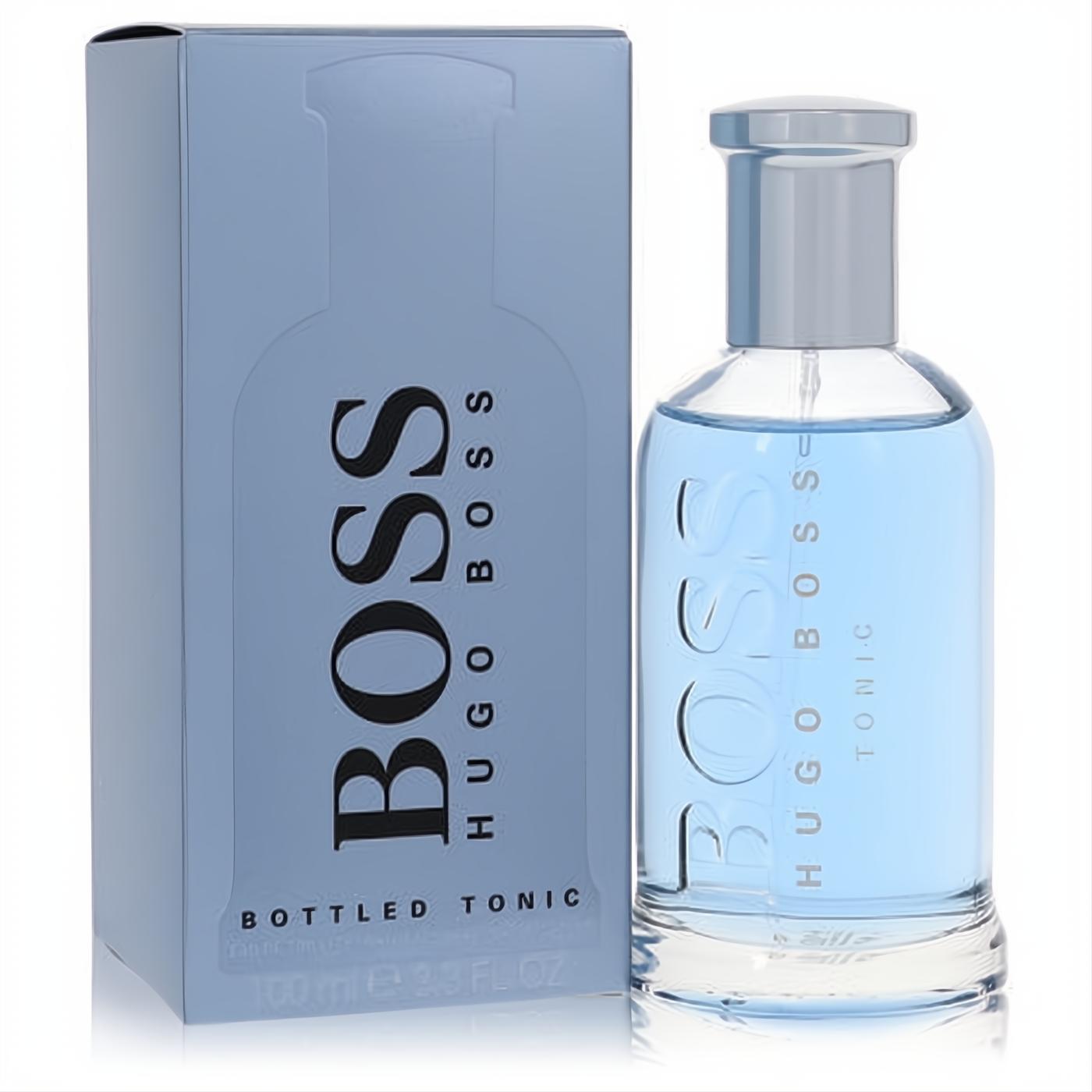 Boss Bottled Tonic 3.3 oz EDT spray. Invigorating light blue cologne in a sleek glass bottle with silver cap, next to its elegant blue box.