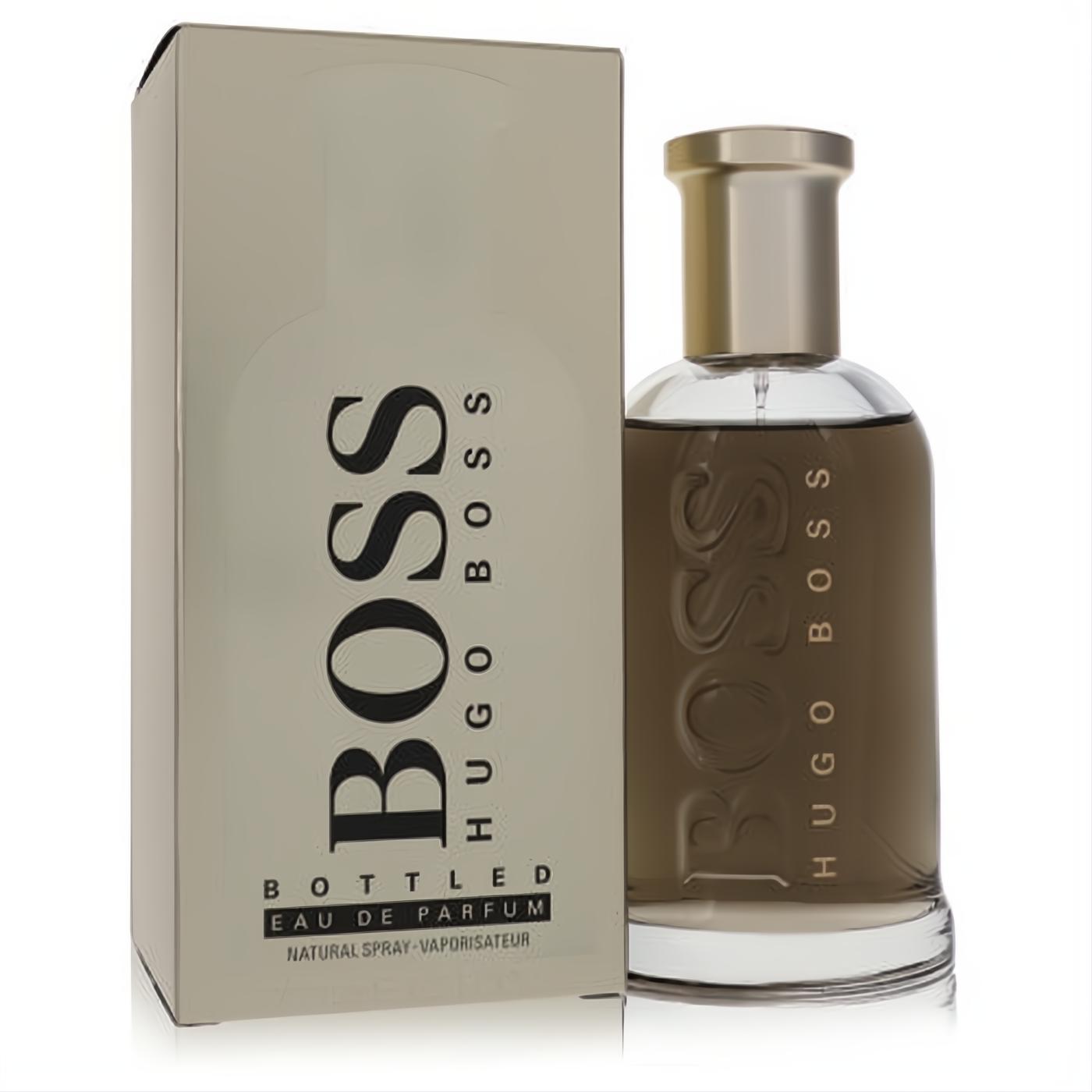 Hugo Boss Bottled Eau De Parfum for men. Elegant clear glass bottle, rich amber liquid, sleek metallic cap, and sophisticated beige box.