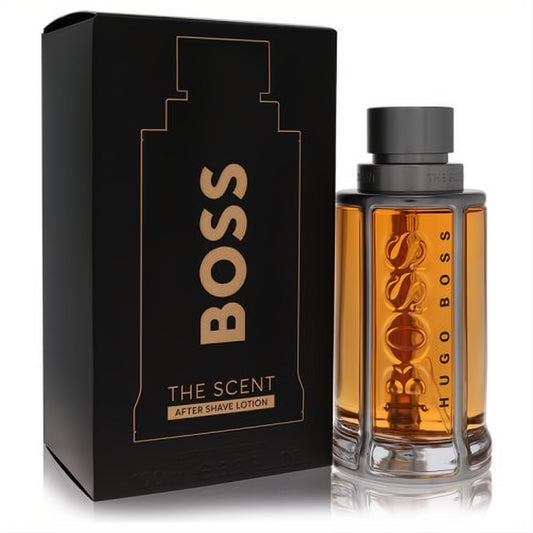 Alluring Boss The Scent After Shave 3.3 oz. Amber liquid in a distinctive ribbed glass bottle with black cap, beside its elegant black and gold box.