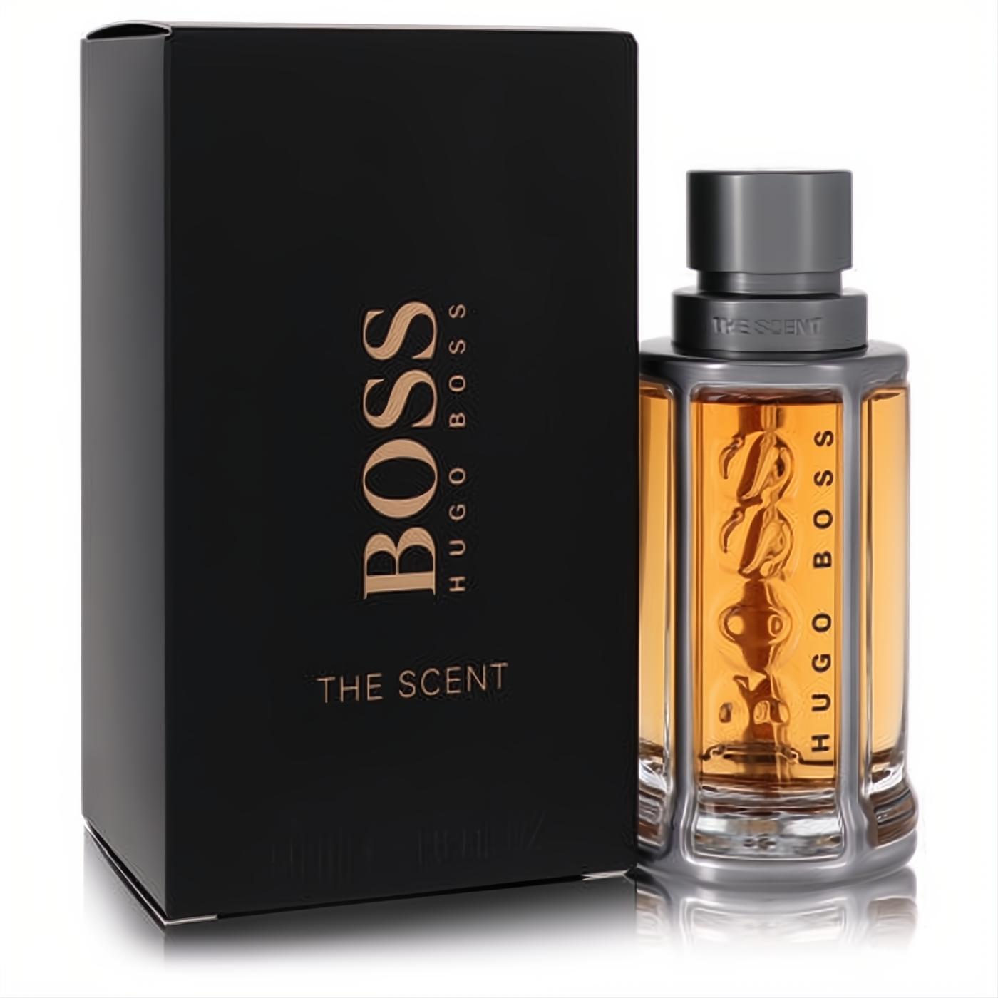 Boss The Scent Eau De Toilette for men. Luxurious black box and a sophisticated amber fragrance bottle with a striking metallic design.