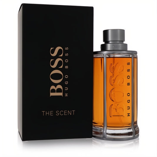 Iconic Boss The Scent by Hugo Boss men's cologne. Features a sleek black box and a striking amber bottle with a silver cage.