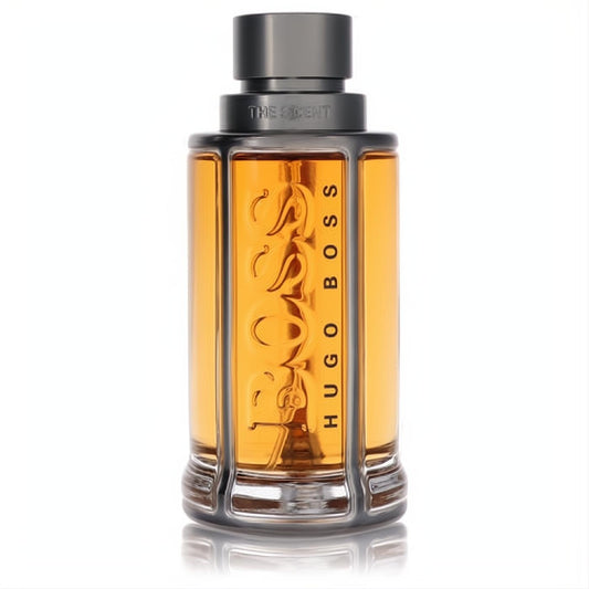 Hugo Boss The Scent men's EDT. Golden amber liquid in a sleek bottle with dark grey cap and metallic BOSS design.