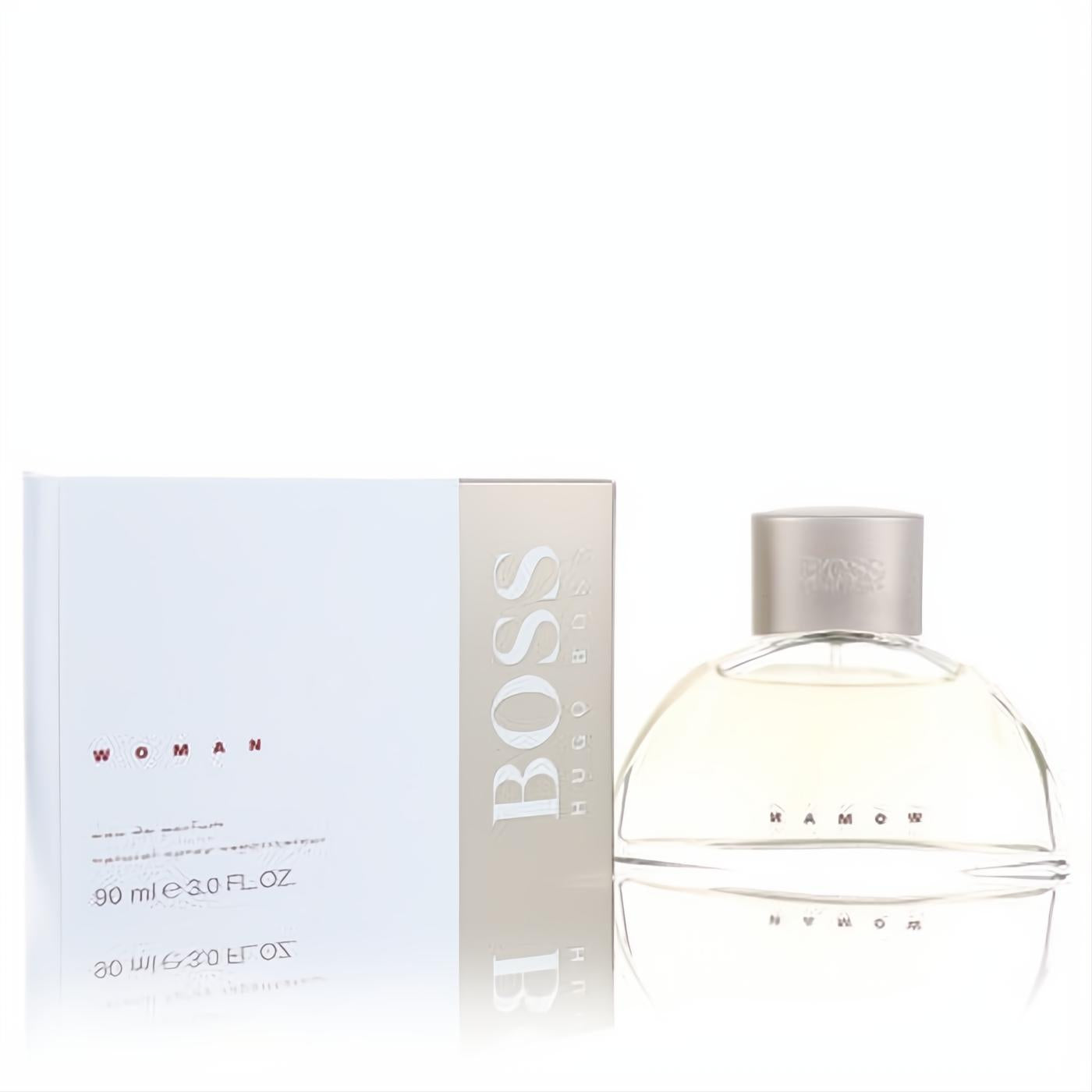 Sophisticated Hugo Boss Boss Woman 3 oz Eau De Parfum. Clear, curved glass bottle with golden liquid and sleek white box.