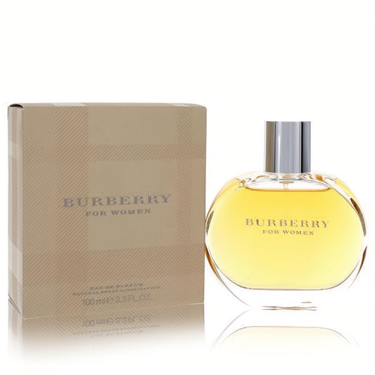 Elegant Burberry for Women 3.3 oz Eau De Parfum. Features a clear oval bottle with golden liquid, silver cap, and a chic beige striped box.
