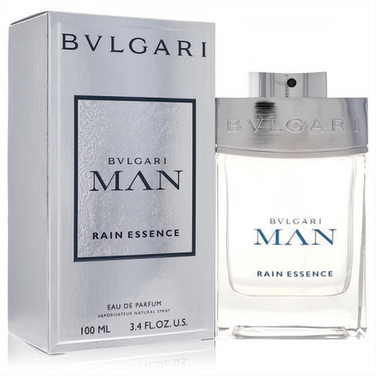 Bvlgari Man Rain Essence 3.4 oz Eau De Parfum. Modern silver box and clear bottle with bold blue "MAN" text.