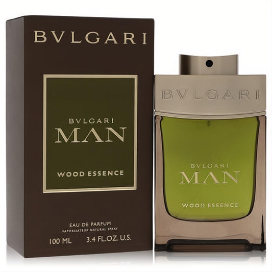 Bvlgari Man Wood Essence 3.4 oz EDP. Sleek green glass bottle with a luxurious gold cap, presented with its elegant brown box.