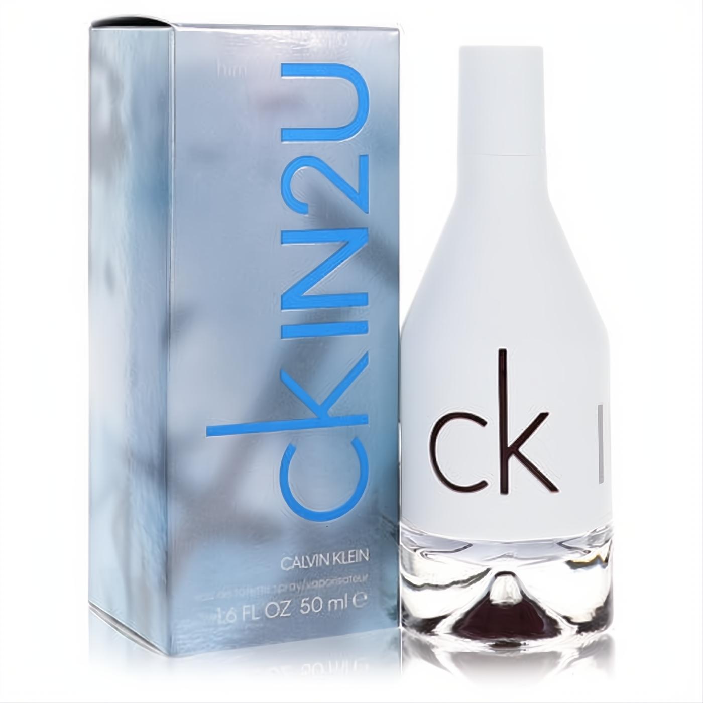 Elevate your style with CK IN2U for Him 1.7 oz EDT. Sleek white bottle, clear base, next to its cool blue Calvin Klein box.