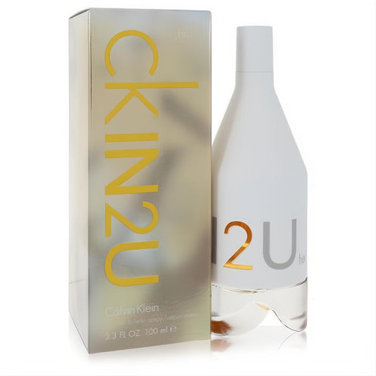 Modern CK In 2U Women's 3.3 oz EDT spray. Features a sleek white bottle with bold gold lettering and a shimmering silver box.