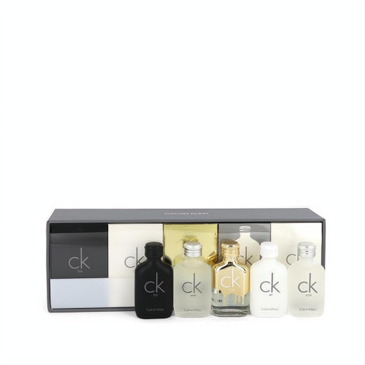Deluxe Calvin Klein fragrance gift set: 6 iconic travel size mini bottles including CK One, CK Be, CK One Gold, CK All in black, gold, and frosted glass.
