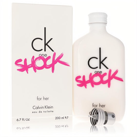 Calvin Klein CK One Shock for Her 6.7 oz EDT. Sleek white bottle with vibrant pink "SHOCK" logo, next to its matching box.