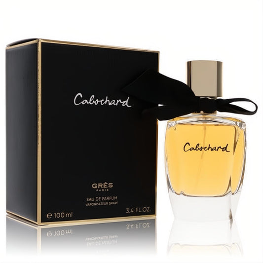 Elegant Cabochard by Parfums Gres 3.4 oz EDP. Golden amber fragrance in clear bottle with gold cap, black ribbon, and chic black/gold box.