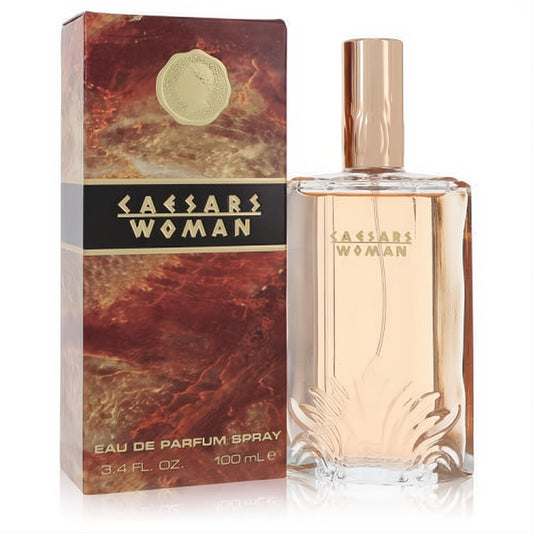 Captivating Caesars Woman 3.4 oz Eau De Parfum. Clear bottle with unique leaf design, rose gold cap, and fiery marbled box.