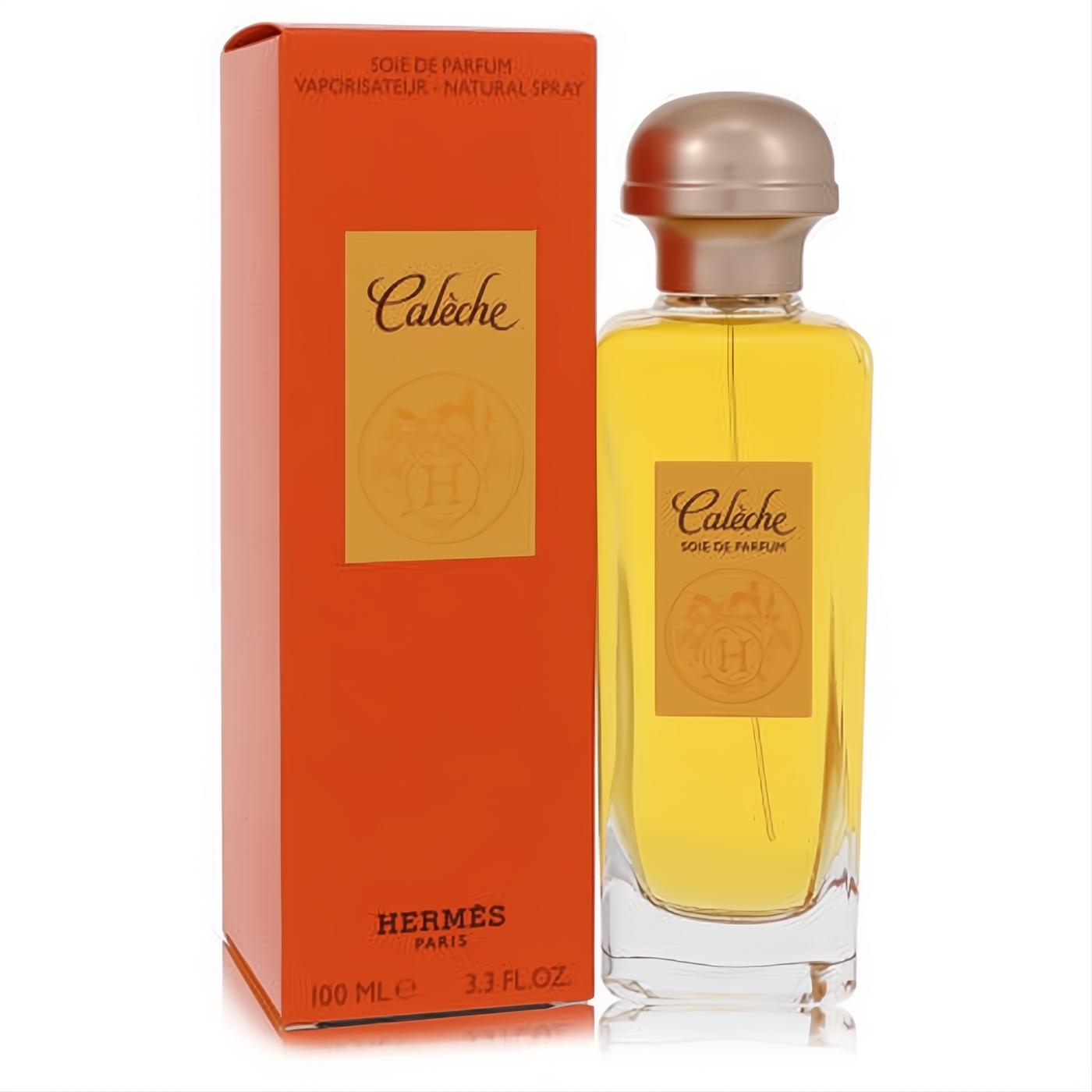 Luxurious Caleche by Hermes Soie De Parfum 3.3 oz spray. Clear glass bottle with amber fragrance, gold cap, and signature orange box.