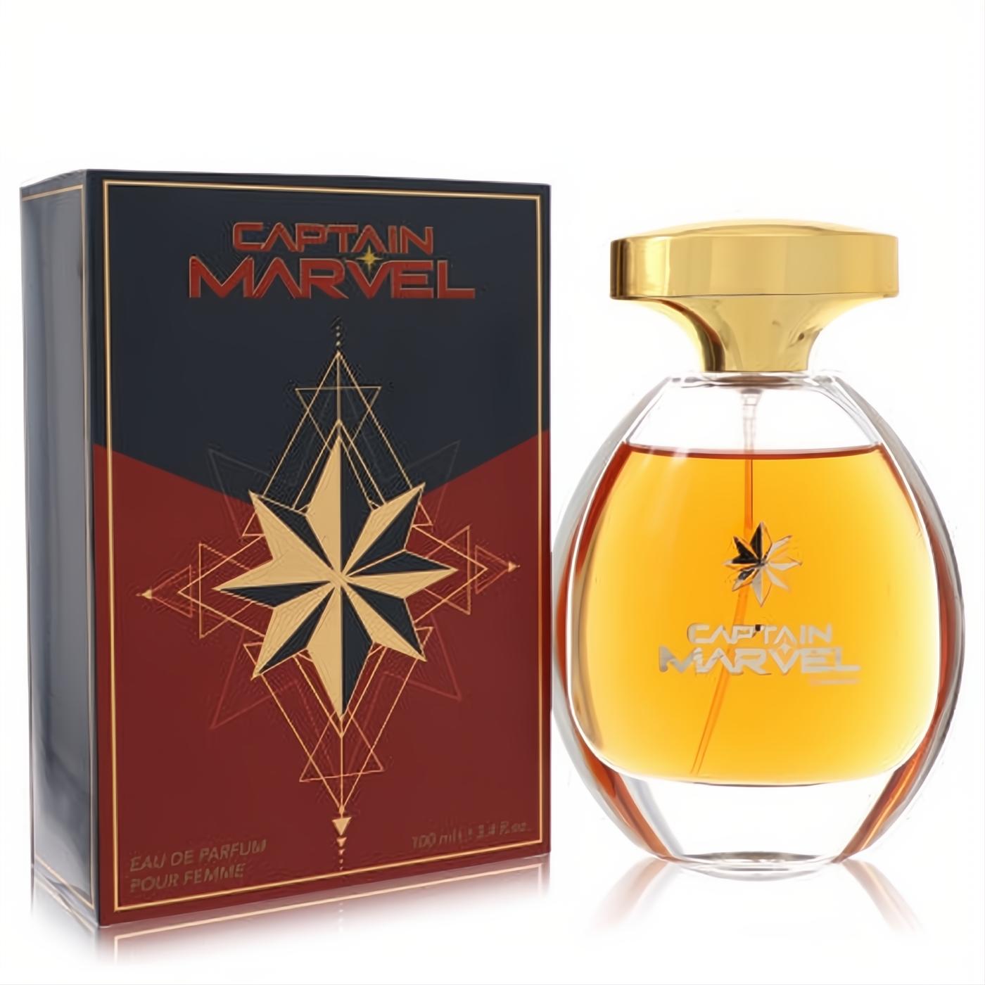 Captain Marvel 3.4 oz EDP: elegant clear glass bottle with amber fragrance, gold cap, and starburst logo, next to its bold blue and red box.
