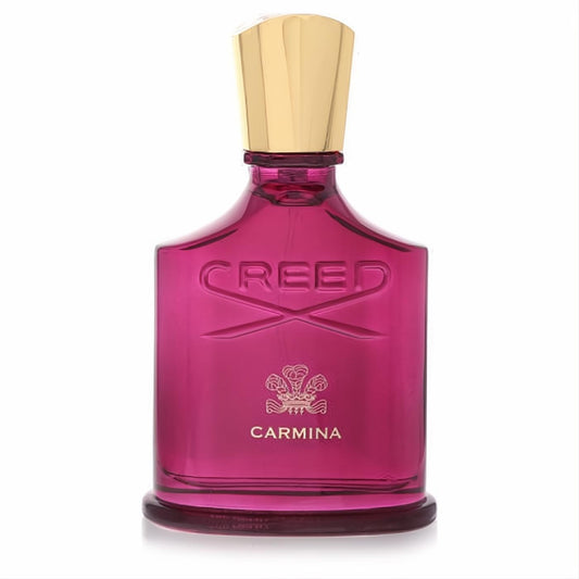 Luxurious Creed Carmina women's Eau De Parfum in a striking magenta glass bottle with embossed logo and elegant gold cap.