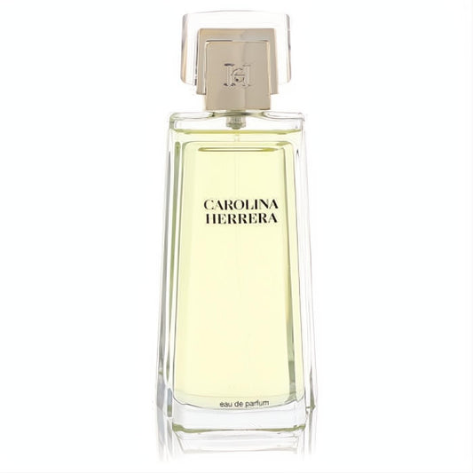 Experience Carolina Herrera Eau De Parfum tester. Elegant clear glass bottle, light yellow fragrance, and signature gold cap.