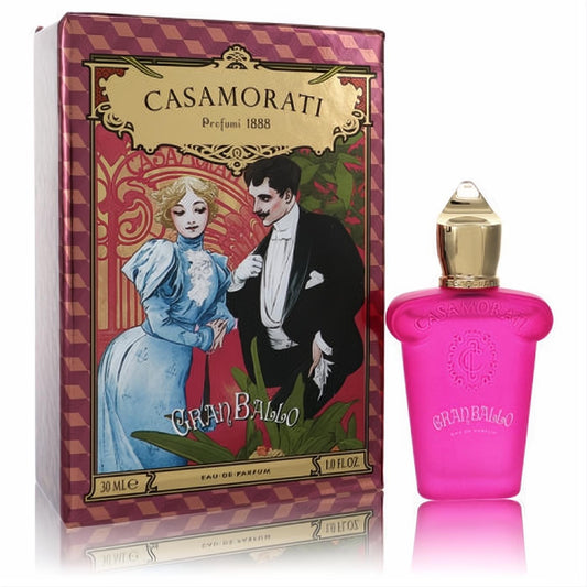 Vibrant pink Casamorati Gran Ballo 1 oz EDP bottle, topped with a golden cap, next to its ornate vintage-illustrated red and gold box.