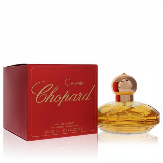 Chopard Casmir 3.4 oz Eau de Parfum. Features a vibrant red box and an elegant amber glass bottle with a distinctive gold cap.